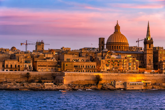 Malta, Valletta, City skyline at sunset and Marsamxett Harbor