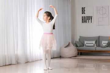 Cute little ballerina at home