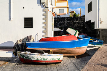 Fototapeta na wymiar Old fishing boats in the port of La Caletta. Tenerife, Canary Islands, Spain