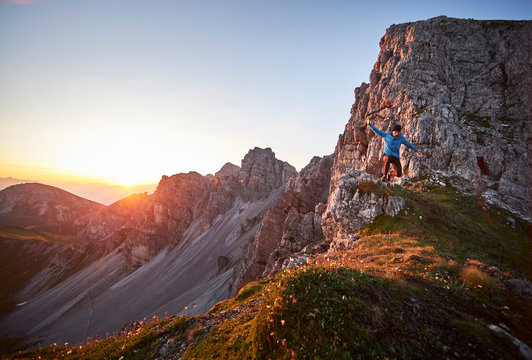 Mature man trail running on mountain ridge at Axame Lizum, Austria