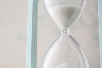 Hourglass on white background, closeup. Time management concept