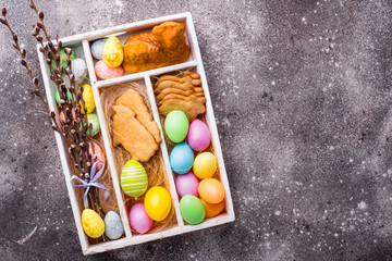 Box with Easter cookies and eggs