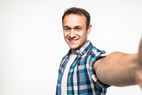 Young handsome man take selfie isolated on white background