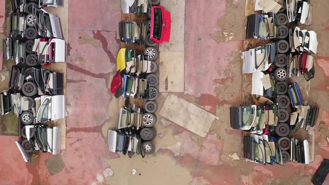 Salvaged Car Doors section at a Large Car parts and Vehicles lot, Aerial view.
