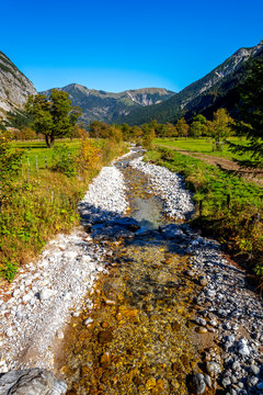 Germany, Karwendel, Vomp, Engalm, Shallow creek an fields in mountain landscape