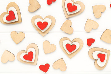 Colorful hearts on white wooden table