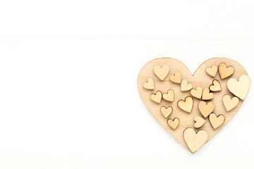 Brown hearts on white wooden table