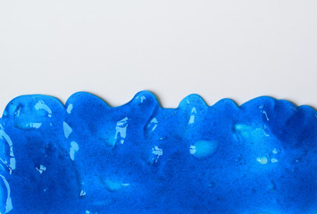 Blue sticky slime on the white surface for background