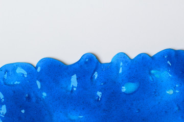 Blue sticky slime on the white surface for background