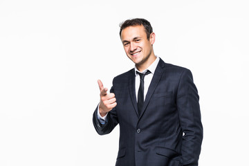 Portrait of smiling young businessman pointing finger at camera isolated on white background