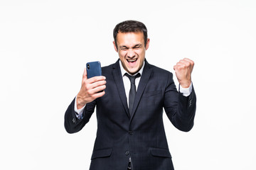 Happy businessman holding smartphone and celebrating his success over 3white background