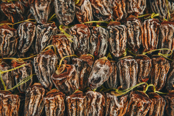 Closeup dried persimmons background