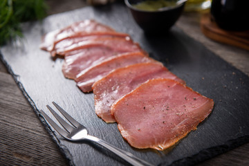 Tasty cold smoked tuna slices