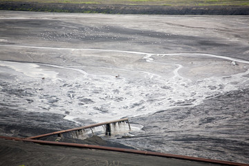 sewage from a plant, soil pollution, a pipe with chemicals