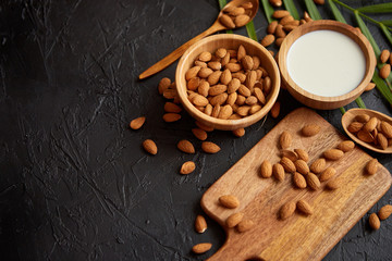 Close up of Almonds in wooden bowl and almond milk