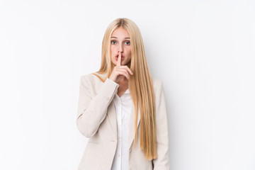 Young business blonde woman on white background keeping a secret or asking for silence.