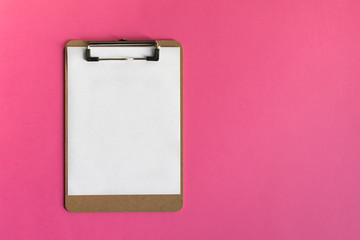 Mock-up clipboard with white paper sheet on pink background. Business, notes and office concept