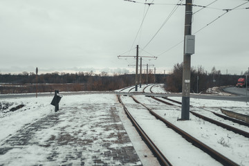 Train rails in winter season. Beautiful landscape of countryside. Rail track laid through forest.