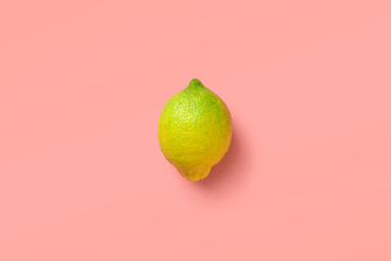 yellow green lemon lime on a pink background
