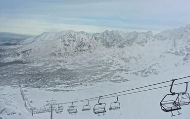 Many Chair lifts on the Kasprowy Wierch peak in Zakopane in winter. Zakopane is a town in Poland in...