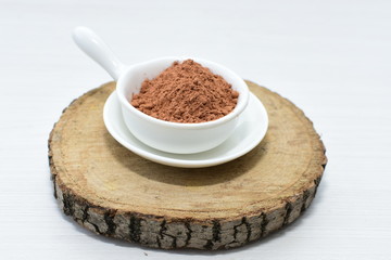  Chocolate powder on wooden background