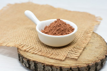  Chocolate powder on wooden background