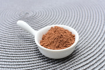  Chocolate powder on wooden background