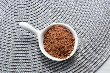  Chocolate powder on wooden background
