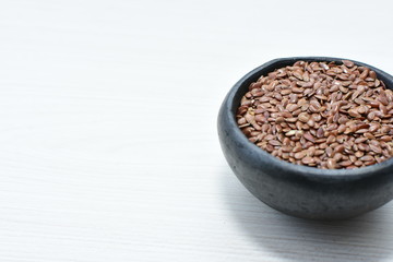 natural flaxseed seeds displayed in containers
