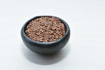  natural flaxseed seeds displayed in containers