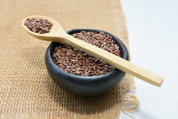  natural flaxseed seeds displayed in containers
