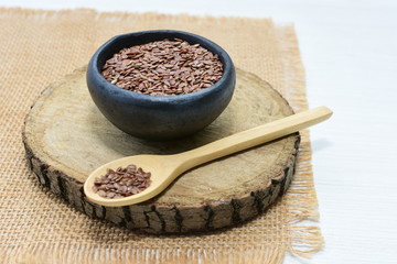  natural flaxseed seeds displayed in containers