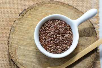  natural flaxseed seeds displayed in containers