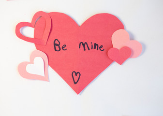 construction paper valentine cards with 'Be Mine' written in child's writing