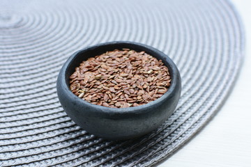  natural flaxseed seeds displayed in containers