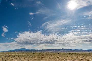 USA, Nevada, Nye County, Basin and Range National Monument, White River Valley. A partly cloud sky...
