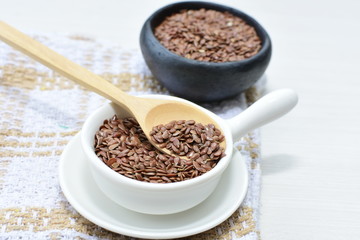  natural flaxseed seeds displayed in containers