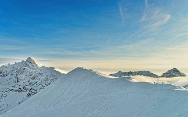Sun and fog in Kasprowy Wierch of Zakopane in Tatra Mounts in winter. Zakopane is a town in Poland in Tatra Mountains. Kasprowy Wierch is a mount in Zakopane and is the most popular ski area in Poland