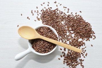  natural flaxseed seeds displayed in containers