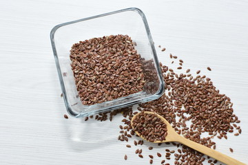  natural flaxseed seeds displayed in containers