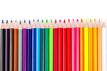 macro multicolored pencils on a white background