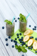 Fresh banana and blueberry smoothie. Diet vegetarian food.