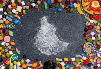 Sugar in the shape of Ethiopia surrounded by a variety of sweets. (series)