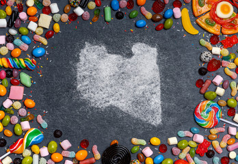 Sugar in the shape of Libya surrounded by a variety of sweets. (series)