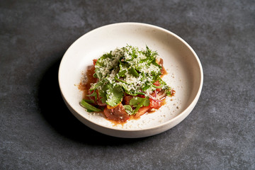 Healthy vegetable salad with grated cheese, close-up