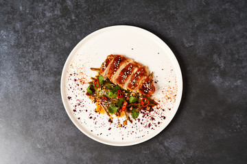 Spicy chicken breast with minted green beans, close-up