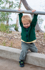 Young 2 year old boy playing outside at a state park