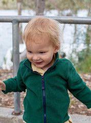 Young 2 year old boy playing outside at a state park