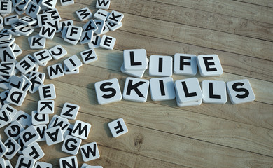Life skills written in letter tiles wood