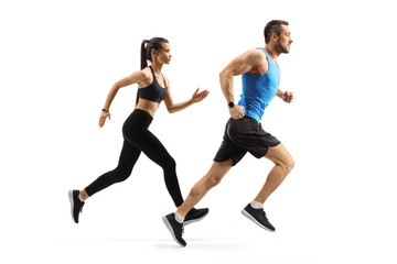 Fit man and woman in sportswear running